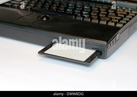 Old Laptop With Floppy Disk Stock Photo