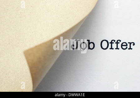 Job Offer text behind paper Stock Photo