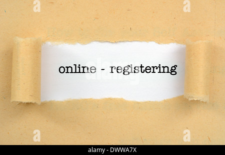 Online - regisrering text on paper hole Stock Photo