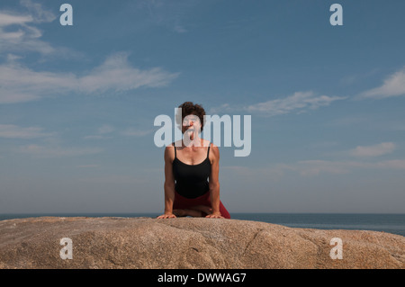 Iyengar Yoga Instructor Demonstrates Simhasana (Sitting). Stock Photo