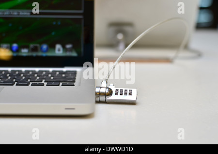 A Laptop physically locked in a showroom! Stock Photo