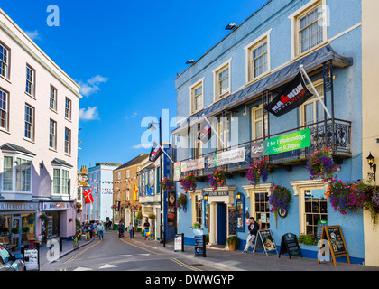 Shops and Tenby House pub on St Julian's Street in the town centre, Tenby, Pembrokeshire, Wales, UK Stock Photo