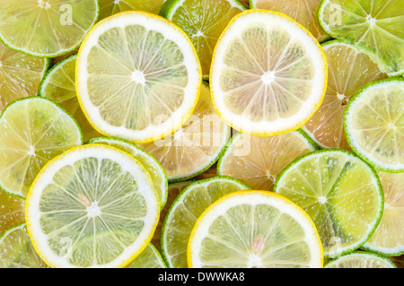Background made of fresh lime and lemon slices Stock Photo