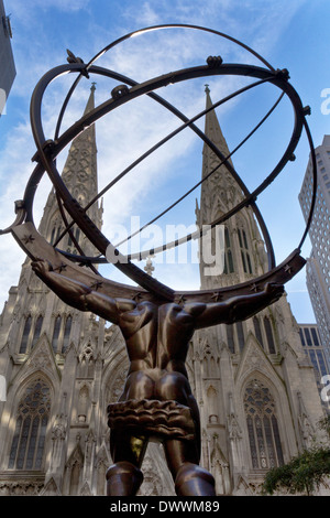 Rockefeller Center Atlas Statue facing St Patrick's Cathedral, New York, USA Stock Photo