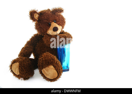 Teddy bear with a blue transparent glass Stock Photo