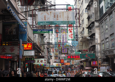Myriad of neon street signs over a busy street in Mong Kok, Kowloon, Hong Kong Stock Photo