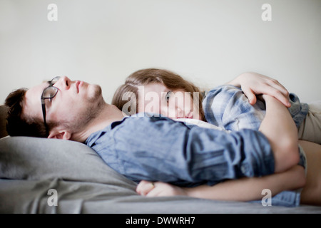 Young couple lying in bed Stock Photo