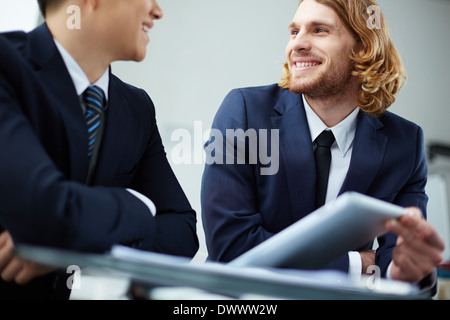 Two business partners discussing new project at meeting Stock Photo
