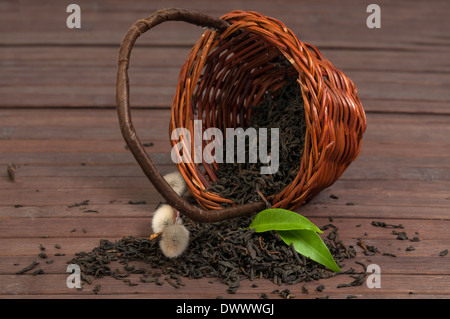 Dry black tea in a bamboo basket Stock Photo