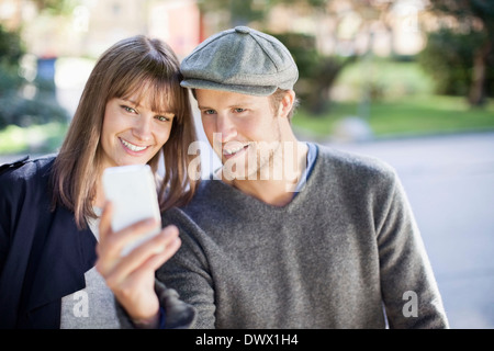 Young couple taking self portrait photography outdoors Stock Photo