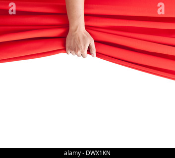 hand opening red curtain on white. Stock Photo