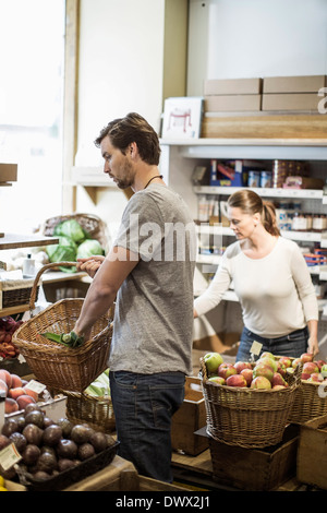 Friends shopping groceries in supermarket Stock Photo