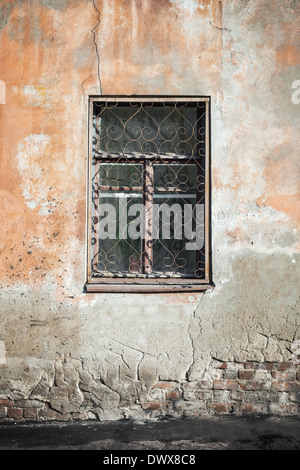 Old living house wall with closed window Stock Photo
