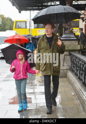 Conan O'Brien and his daughter Neve spotted walking in the rain under
