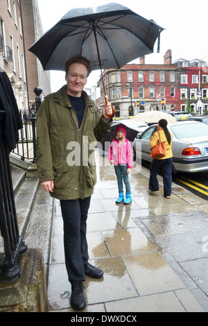 Conan O'Brien and his daughter Neve spotted walking in the rain under