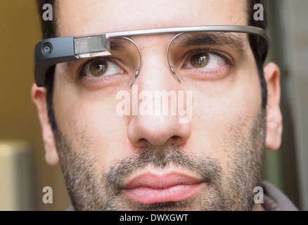 Close up portrait of young man wearing Google Glass