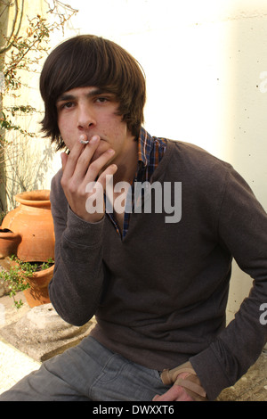 Charlie smoking in Exmouth, Devon. 14-03-2014 Stock Photo