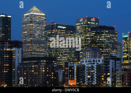 Skyscrapers and apartments at Canary Wharf on the Isle of Dogs, East London UK,  illuminated, in the evening Stock Photo