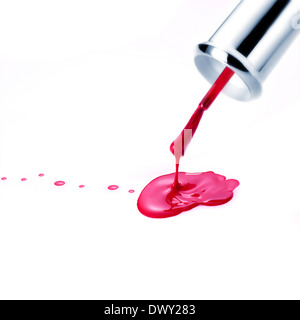 Red Nail Polish and brush dripping. Isolated on white Stock Photo