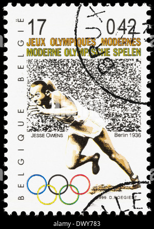 Belgium postage stamp with an illustration of Jesse Owens in the 1936 Berlin Olympics. Stock Photo