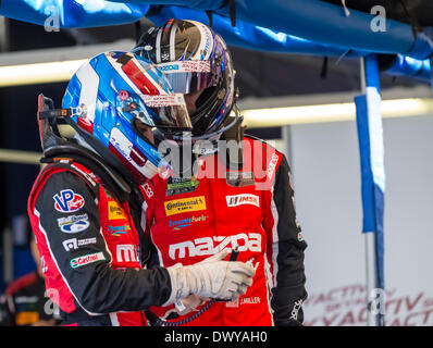 Sebring, FL, USA. 13th Mar, 2014. Sebring, FL - Mar 13, 2014: Teammates Tristian Vautier and Joel Miller discuss strategy before a practice session for the 12 Hours of Sebring at Sebring International Raceway in Sebring, FL. © csm/Alamy Live News Stock Photo