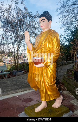 Co Lam Vietnamese Buddhist temple. This statue depicts the Buddha with his begging bowl as he seeks food for the day. Stock Photo