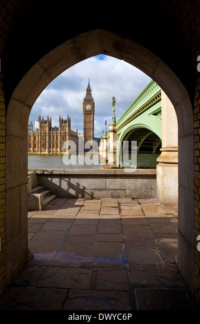 A view of the Houses of Parliament from one of the walkways on the Thames Path in London. Stock Photo