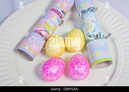 An image showing the concept of Easter with colored eggs and crackers Stock Photo