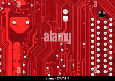 Closeup of a red printed circuit board Stock Photo
