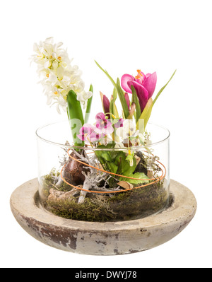 Artificial flowers made of plastic in a glass bowl Stock Photo