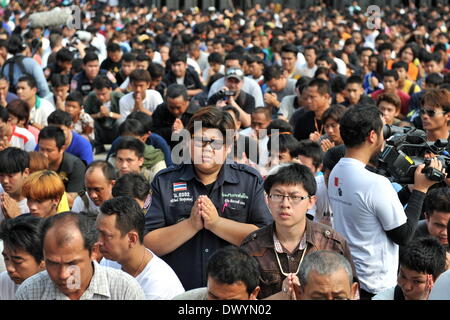 Bangkok. 15th Mar, 2014. A devotee prays during the annual Tattoo Festival at Wat Bang Phra in Nakhon Pathom province of Thailand, March 15, 2014. Thousands of believers from all around Thailand and abroad travelled to attend the annual Tattoo Festival in Nakhon Pathom province. Credit:  Gao Jianjun/Xinhua/Alamy Live News Stock Photo