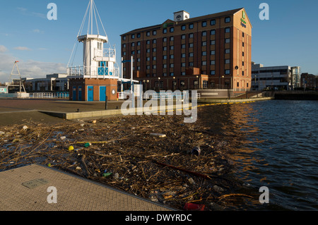 Holiday Inn Express at Welland Lock, Salford Quays, Manchester, England, UK.  With a lot of floating debris in the foreground. Stock Photo