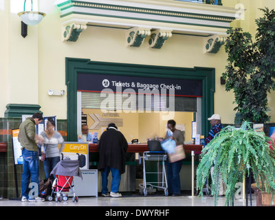 Travelers in Line at Ticket & Baggage Check -in Counter, Main Waiting Area,Tampa Union Station (TUS), Tampa, Fl,USA Stock Photo