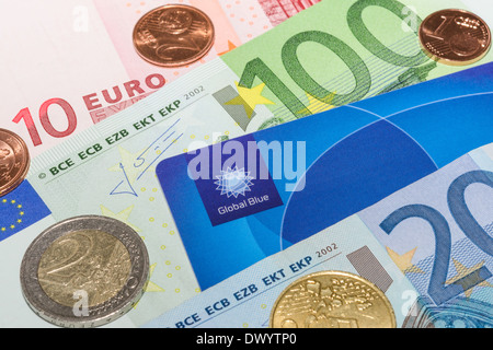 MUNICH, GERMANY - FEBRUARY 23, 2014: European currency notes and coins with Tax Free plastic card Stock Photo