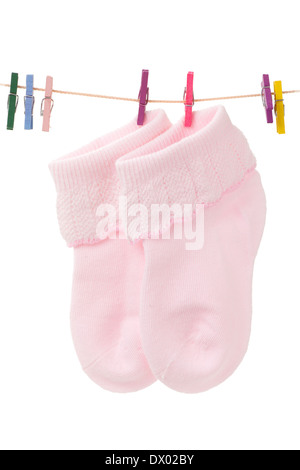 baby socks with pink clothespins,isolated on white Stock Photo