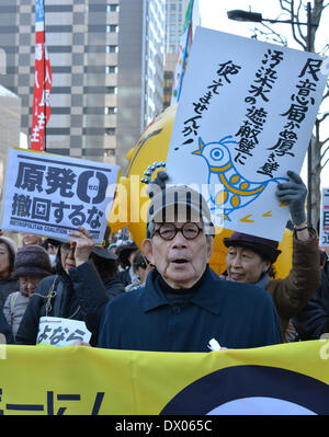 Tokyo, Japan. 15th Mar, 2014. Nobel laureate Kenzaburo Ohe leads a massive anti-nuclear power protest march in Tokyo on Saturday, March 15, 2014. Some 5,000 demonstraoirs marched down the streets of Tokyo, protesting against the planned restart of nuclear reactors before the third anniversary of the meltdown of Fukushina No. 1 nuclar plant. Credit:  Natsuki Sakai/AFLO/Alamy Live News Stock Photo