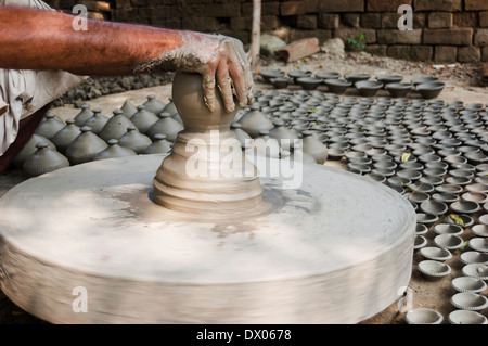 1 Indian Potter Preparing Pots Stock Photo