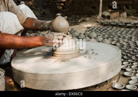 1 Indian Potter Preparing Pots Stock Photo