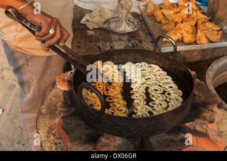1 Indian Villager Preparing Sweets Stock Photo