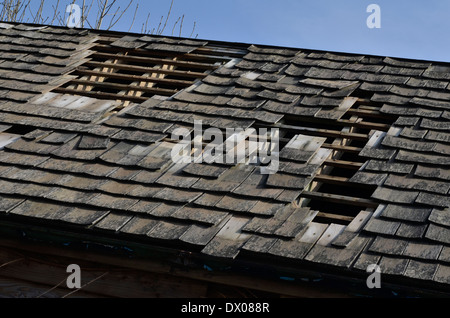 Wooden tiled roof damaged by storm / high winds. Possible ...