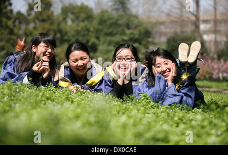 Nanjing, China's Jiangsu Province. 16th Mar, 2014. Students pose for graduation photos at the Nanjing University of Science and Technology in Nanjing, capital of east China's Jiangsu Province, March 16, 2014. © Wang Xin/Xinhua/Alamy Live News Stock Photo