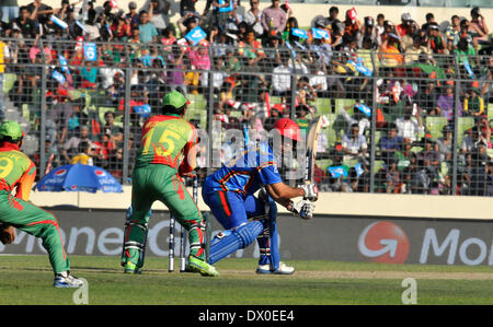 Dhaka, Bangladesh. 16th Mar, 2014. Karim Sadiq (R) of Afghanistan plays a shot during the International Cricket Council (ICC) Twenty 20 World Cup opening match against Bangladesh at Sher-e-Bangla Stadium in Dhaka, Bangladesh, March 16, 2014. Credit:  Shariful Islam/Xinhua/Alamy Live News Stock Photo