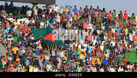 Dhaka, Bangladesh. 16th Mar, 2014. Bangladeshi supporters cheer during the International Cricket Council (ICC) Twenty 20 World Cup opening match between Bangladesh and Afghanistan at Sher-e-Bangla Stadium in Dhaka, Bangladesh, March 16, 2014. Credit:  Shariful Islam/Xinhua/Alamy Live News Stock Photo