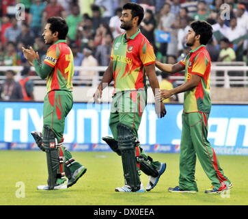 Dhaka, Bangladesh. 16th Mar, 2014. Players of Bangladesh celebrate the fall of the wicket of Afghanistan during the International Cricket Council (ICC) Twenty 20 World Cup opening match at Sher-e-Bangla Stadium in Dhaka, Bangladesh, March 16, 2014. Credit:  Shariful Islam/Xinhua/Alamy Live News Stock Photo