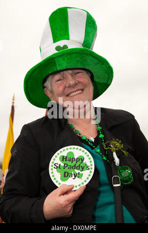 Manchester UK, 16th March 2014.  'Happy St Paddy's day' badge worn by participant at the St Patrick's Day religious procession in Manchester.  Feast of Saint Patrick (Irish: Lá Fhéile Pádraig, 'the Day of the Festival of Patrick') is a cultural and religious holiday celebrated annually on 17 March, the death date of the most commonly-recognised patron saint of Ireland, Saint Patrick. Credit:  Cernan Elias/Alamy Live News Stock Photo