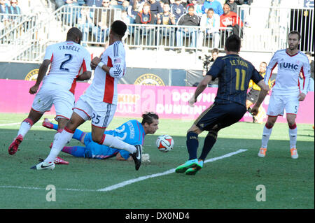 French soccer player / Frenchman football player / Philadelphia Union forward Sebastian Le Toux challenges New England Revolution goalie Bobby Shuttleworth as the ball is bobbled and pops out. three soccer defenders look on. Stock Photo