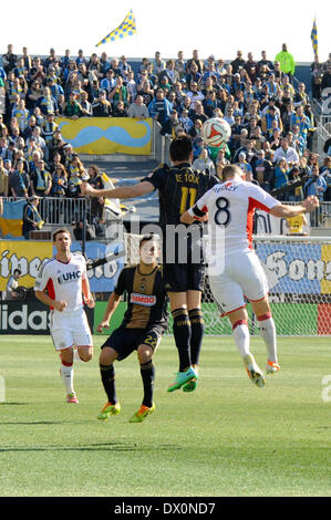 French soccer player / Frenchman football player / Philadelphia Union Forward / Striker Sebastian Le Toux jumps / leaps up for a header during a soccer / football match with the New England Revolution at Talen Energy Stadium in Chester PA United States of America during a sunny fall / autumn day outside of Philadelphia Stock Photo