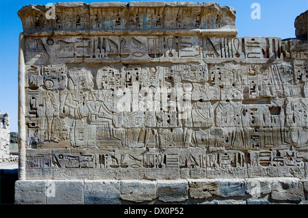 Mortuary temple of Ramses III at Medinet Habu:wall with hieroghlyphs and various deities Stock Photo