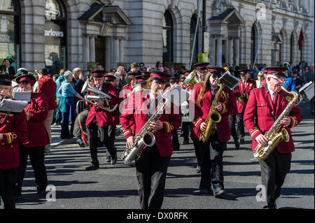 London, UK. 16 March 2014. The Castlerea Brass and Pipe Band marching during the annual St Patrick's day parade in London.Photographer:  Gordon Scammell/Alamy Live News Stock Photo