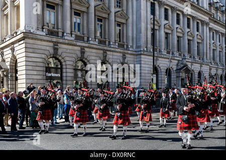 London, UK. 16 March 2014. The Essex Caledonian Pipe Band marching during the annual St Patrick's day parade in London. Photographer:  Gordon Scammell/Alamy Live News Stock Photo